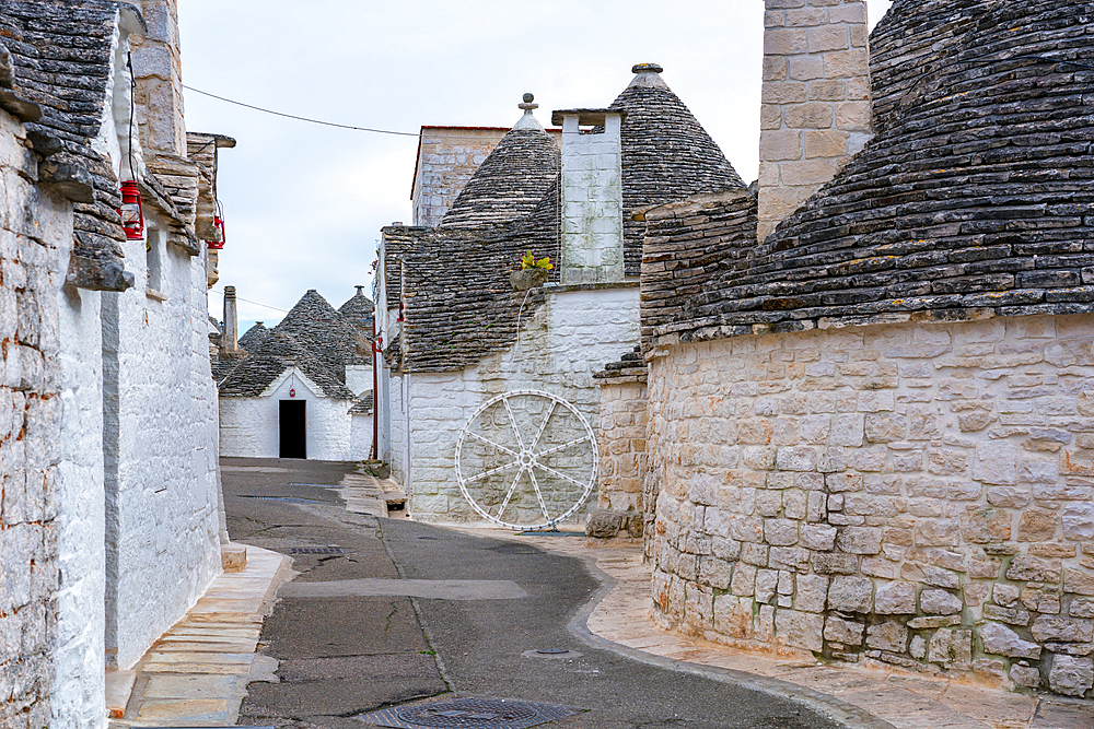 Alberobello iconic old Trullo and Trulli white houses with stone ceilings in conic shape, in Italy