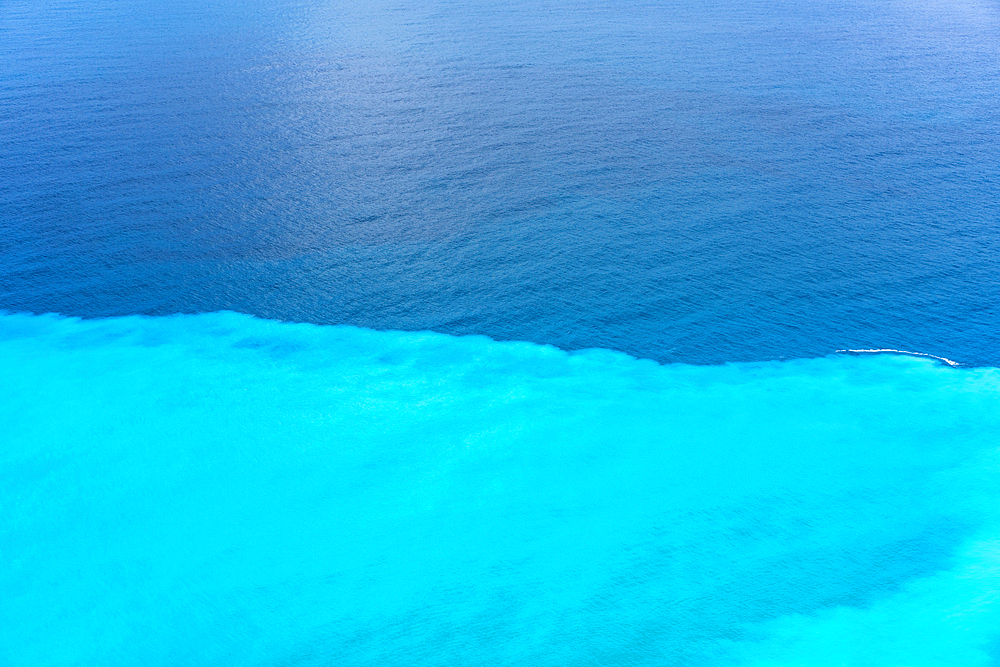 Sea division between turquoise water and deep blue, in Greece