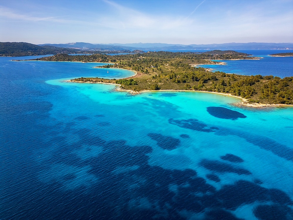 Diaporos island with wild beaches with turquoise water drone aerial view in Greece