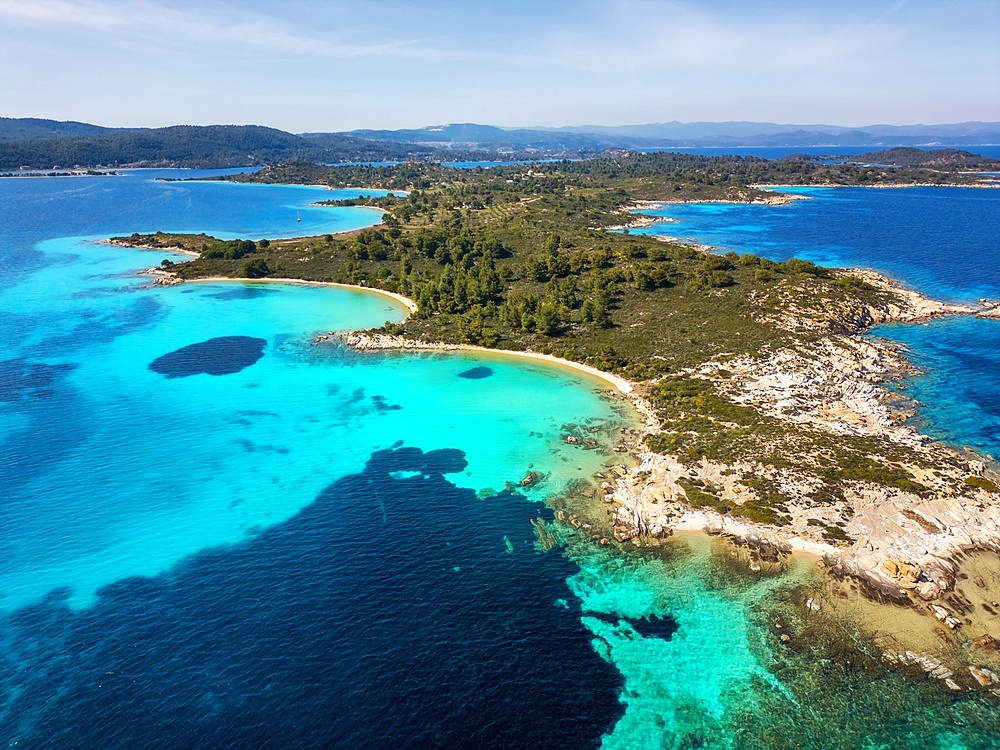 Diaporos island with wild beaches with turquoise water drone aerial view in Greece