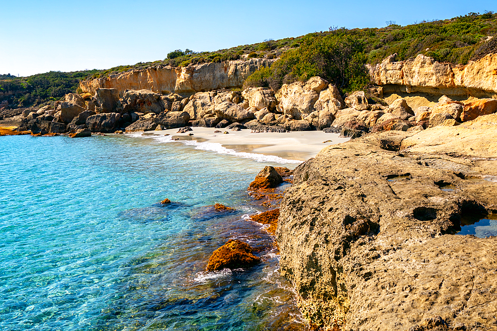 Petrified forest Agia Marina Agios Nikolaos Geopark beach with turquoise water in the south of Greece