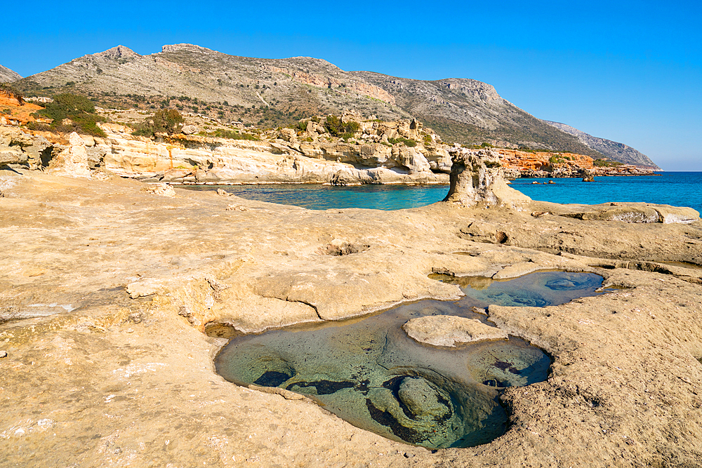 Petrified forest Agia Marina Agios Nikolaos Geopark beach with turquoise water in the south of Greece