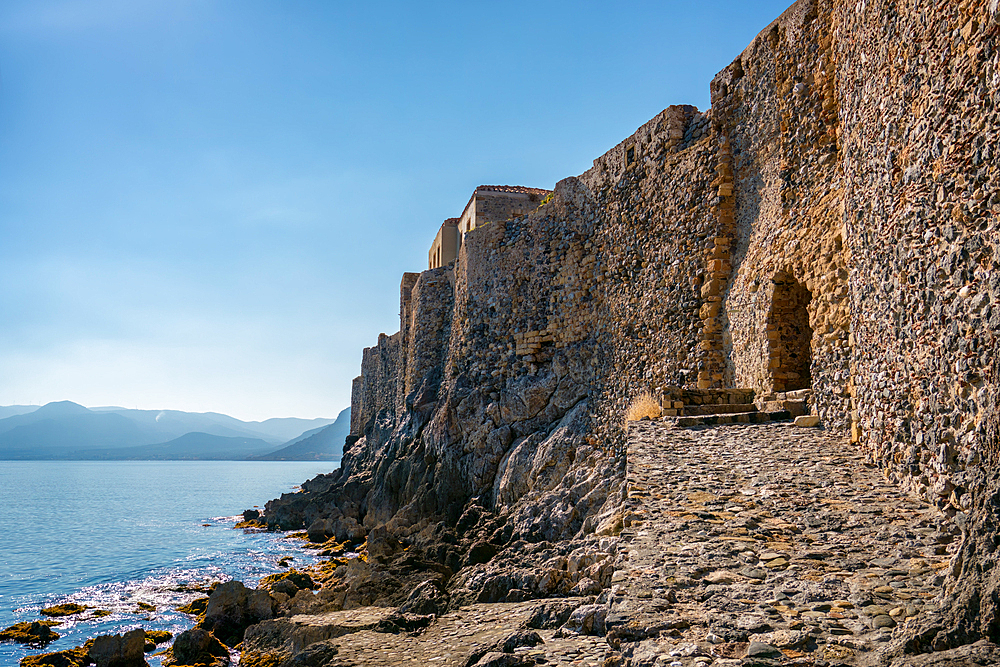 Monemvasia island historic city castle near the turquoise sea water, in Greece