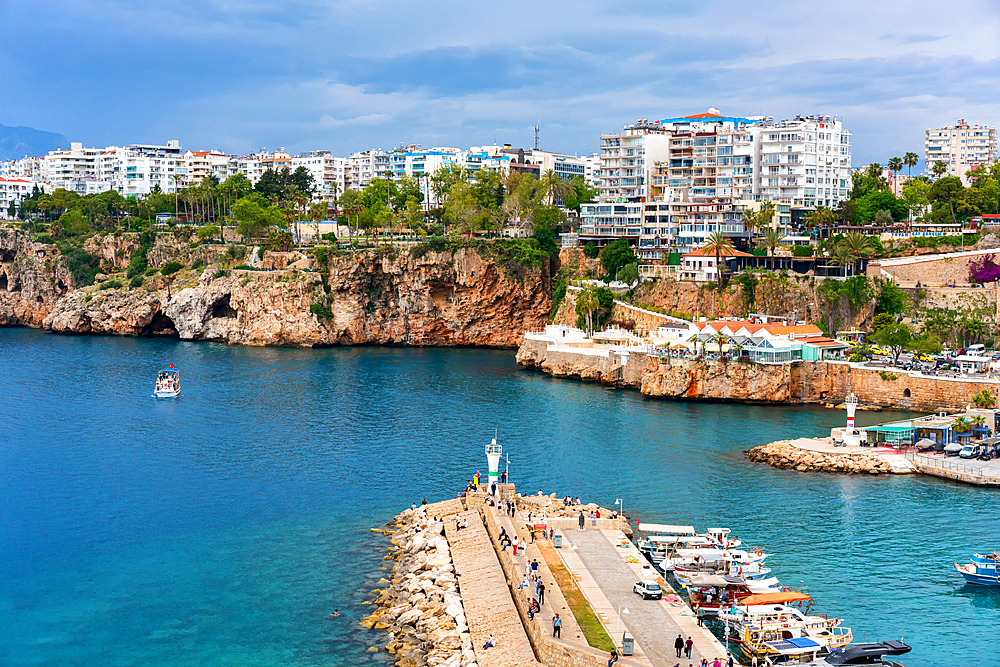 Antalya city and port view with boats in the marina in turquoise water in Turkey
