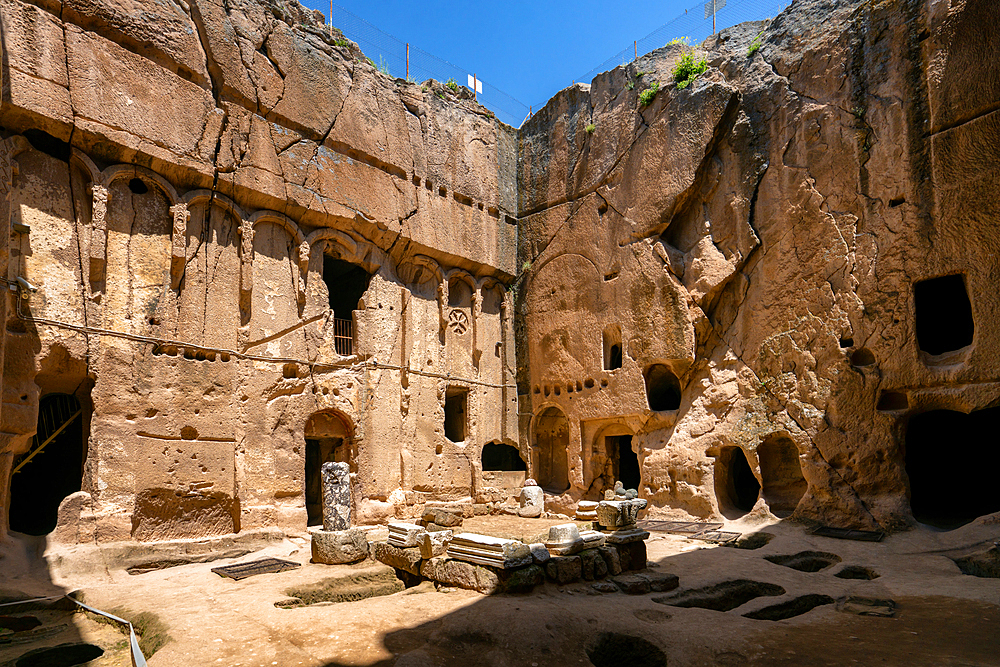 Gumusler ancient monastery with caves on the rock in Turkey