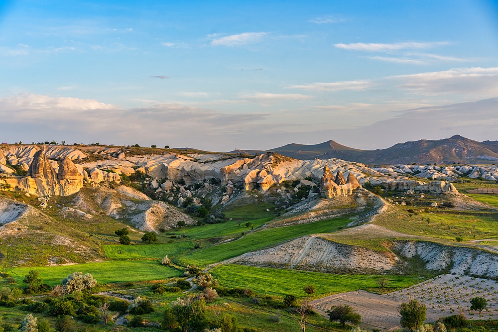 Love valley with beautiful rock formations at sunrise in Cappadocia, Turkey