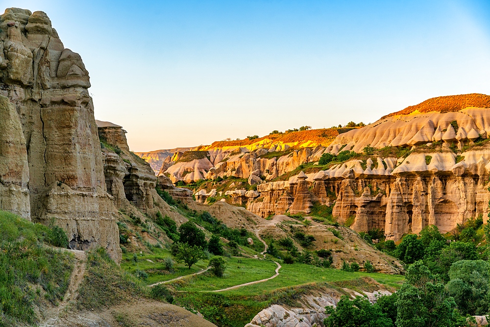 Pidgeon valley rock formations landscape in Cappadocia, Turkey at sunset
