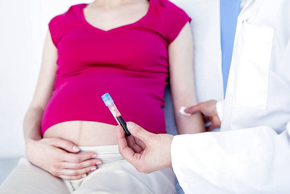 Blood sample being taken from pregnant woman.
