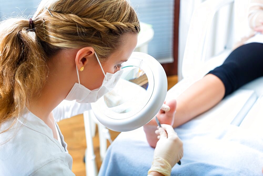 Woman receiving podiatry treatment in a Day Spa.