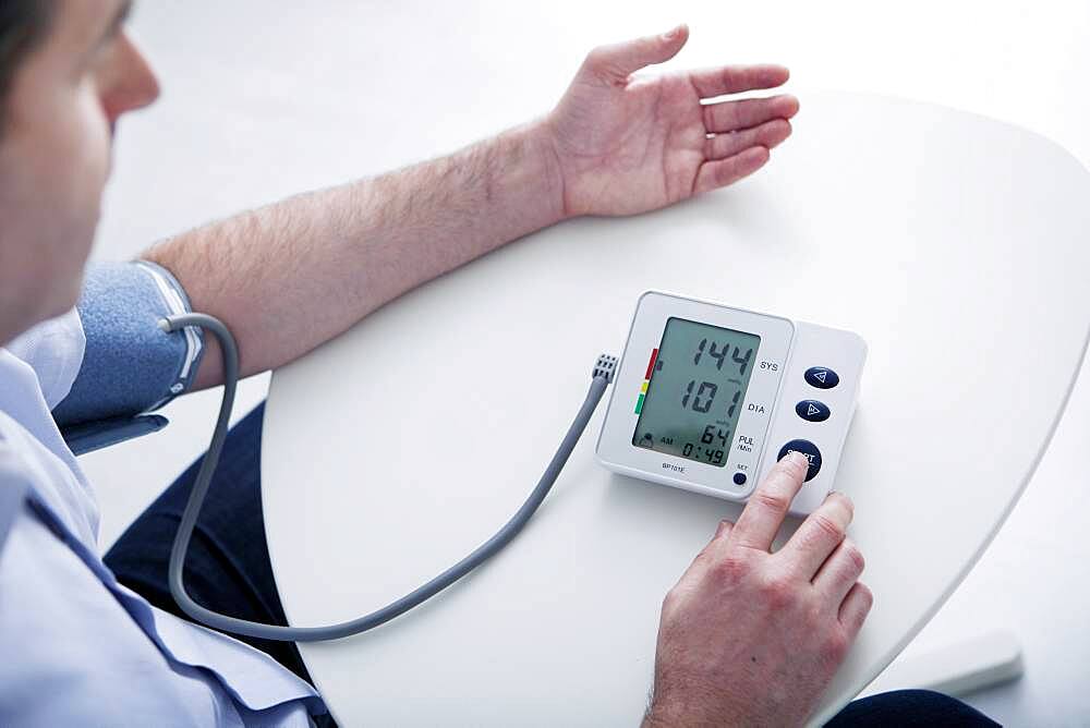 Man measuring his blood pressure.