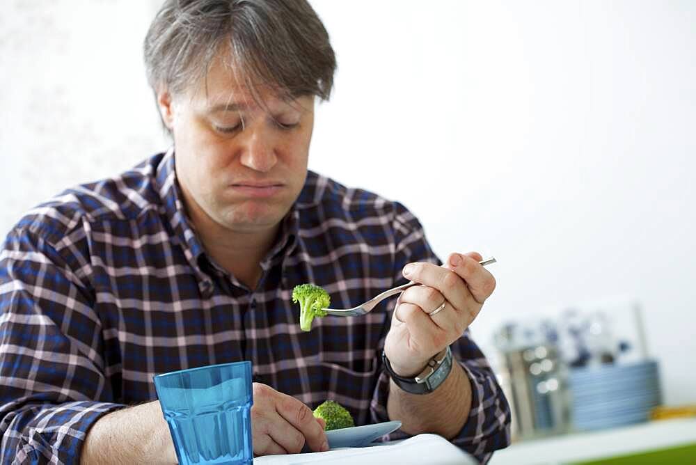 Man eating vegetable