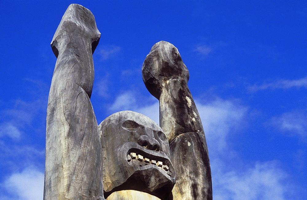 Carved wooden Ki'i (tiki) at 'Ahu'ena Heiau, a restored ancient Hawaiian temple; Kailua-Kona, Island of Hawaii.