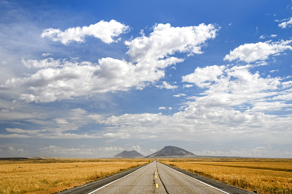 US Highway 20 with Big Butte and East Butte in the distance, eastern Idaho.