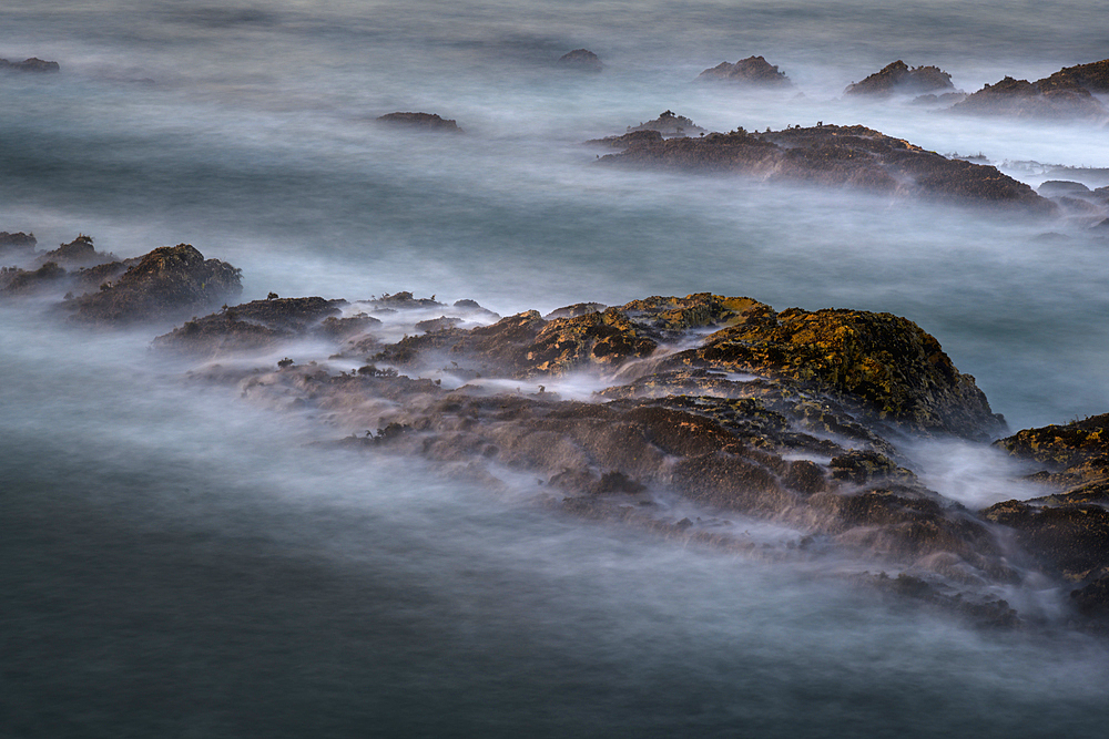 A view from Bluff trail of waves washing over rock fins at Monta√±a de Oro State Park, on the central California coast.