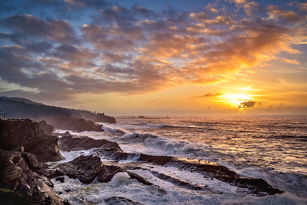 Sunset and storm surf at Shore Acres State Park on the southern Oregon coast.