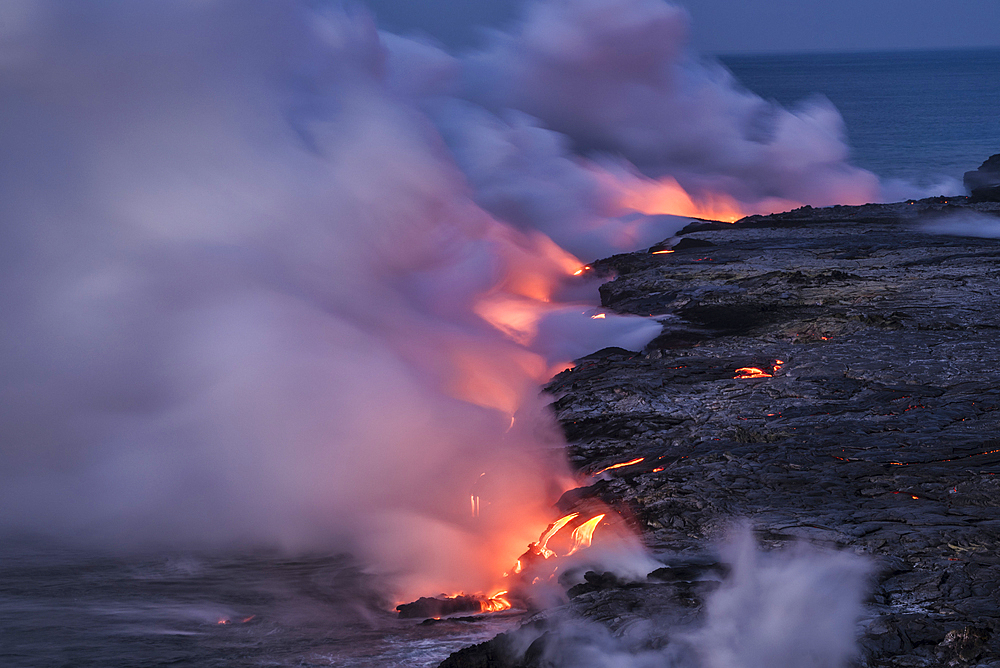 Lava from Pu'u O'o eruption entering the ocean; Hawaii Volcanoes National Park, Island of Hawaii.