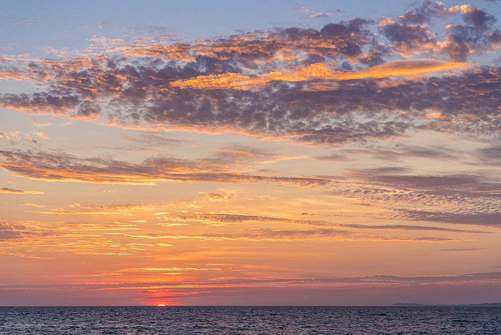 Sunset over Bay of Banderas from the Malecon in Puerto Vallarta, Jalisco, Mexico.