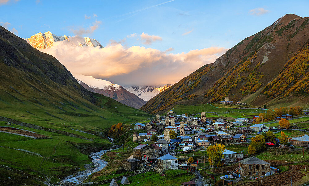 Sunset view of Ushguli, with Mount Shkhara covered in cloud, Mestia, Samegrelo-Upper Svaneti, Georgia (Sakartvelo), Central Asia, Asia