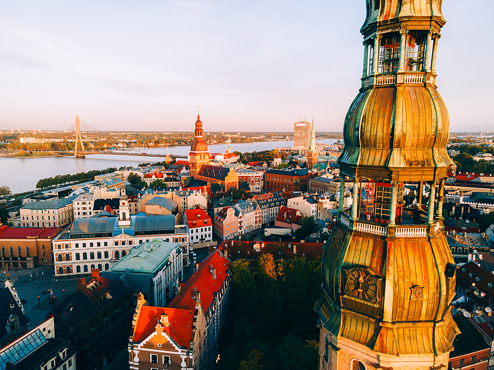 Aerial drone sunrise view of St. Peter's Church in Riga Old Town (Vecriga), UNESCO World Heritage Site, Riga, Latvia, Europe