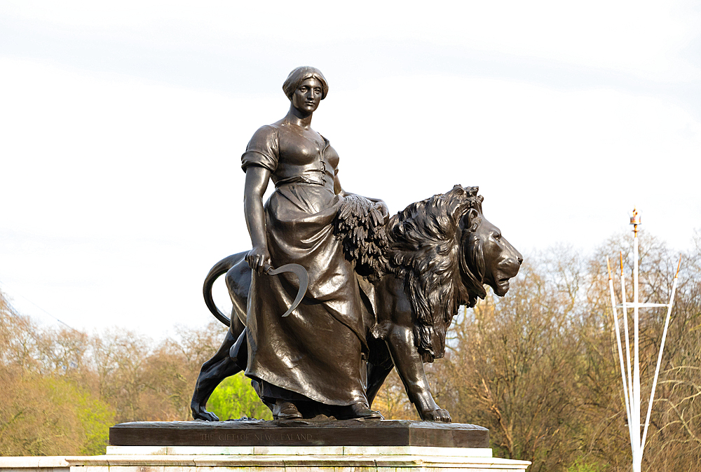 Bronze figure of Agriculture supported by a bronze lion, Victoria Memorial, The Mall, London, England, United Kingdom, Europe