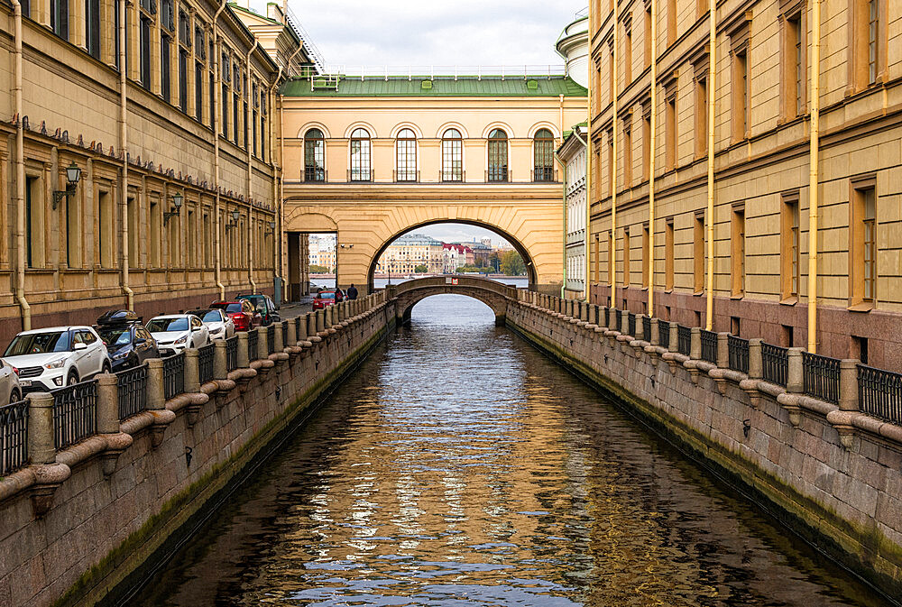 View towards Hermitage Bridge over Zimniaya Kanavka (Winter Canal), and Neva River beyond, St. Petersburg, Russia, Europe