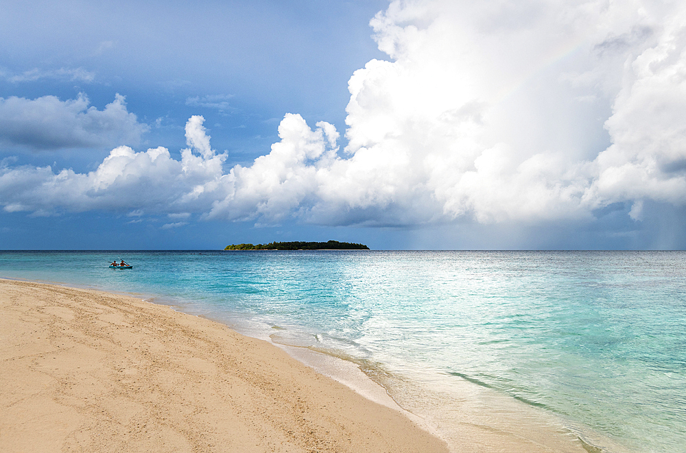 A couple canoeing in Baa Atoll, Maldives