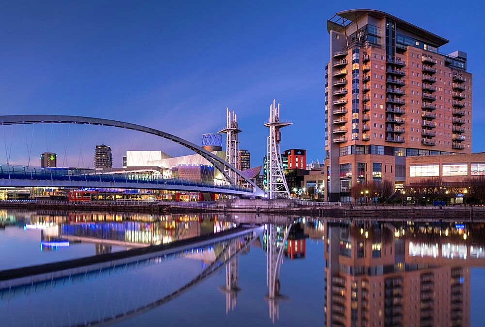 The Lowry Footbridge, Imperial Point Building and Lowry Centre at night, Salford Quays, Salford, Manchester, England, United Kingdom, Europe