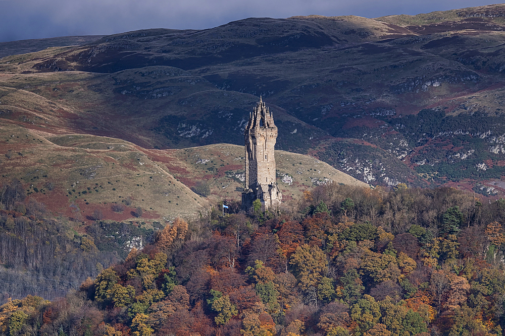 The National Wallace Monument on Abbey Craig backed by the Ochil Hills in autumn, Stirling, Stirlingshire, Scotland, United Kingdom, Europe