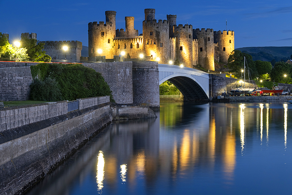 Conwy Castle (Welsh: Castell Conwy) across the River Conwy at night, Conwy, Conwy County Borough, North Wales, UK