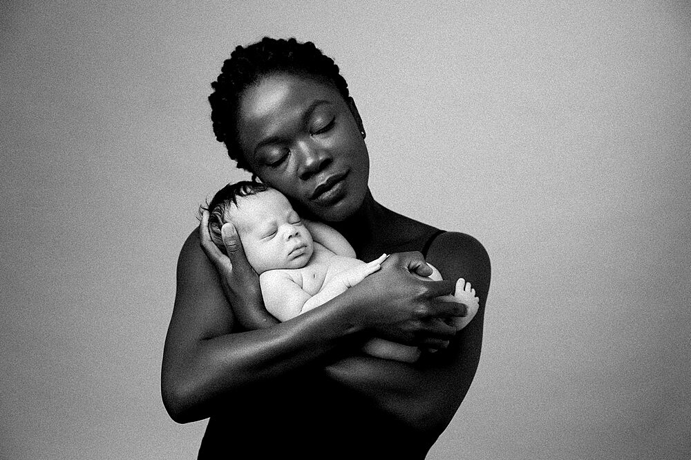 Mother with a baby, studio shot, United Kingdom, Europe