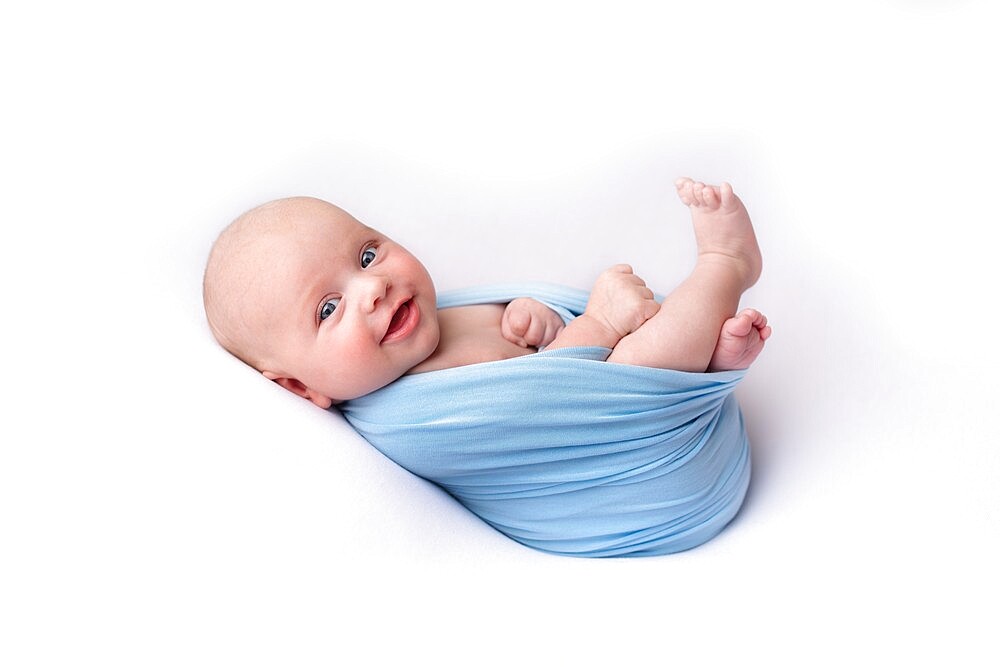 Smiling baby, studio shot, United Kingdom, Europe