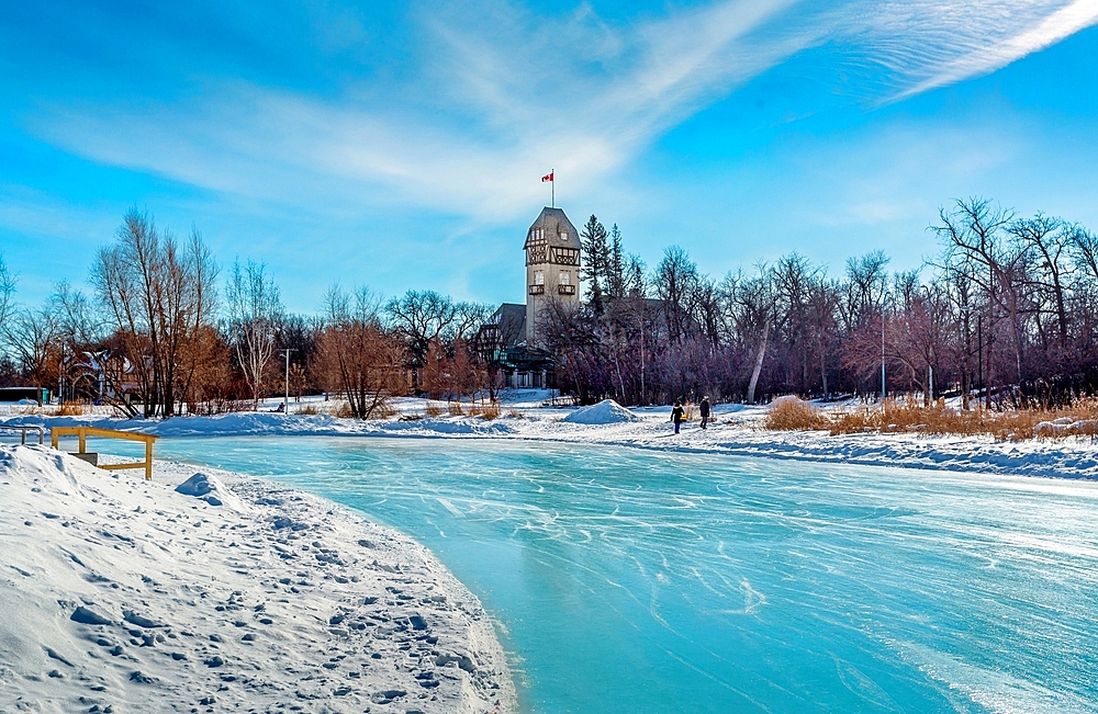 The Assiniboine Park Pavilion seen across the Duck Pond skating rink at Assiniboine Park, Winnipeg, Manitoba, Canada, North America