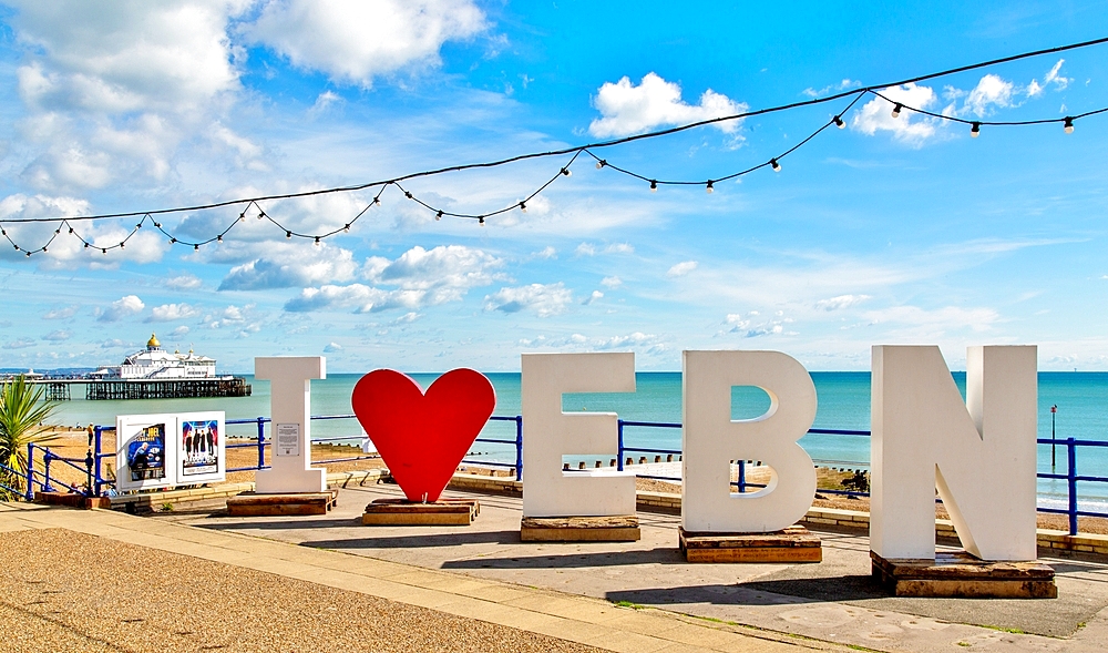 Sign welcoming visitors and holidaymakers on the seafront at Eastbourne, East Sussex, England, United Kingdom, Europe