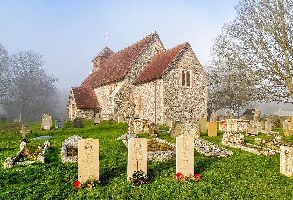 The 11th century Church of St. Mary The Virgin on a foggy winter morning, Friston, South Downs National Park, East Sussex, England, United Kingdom, Europe