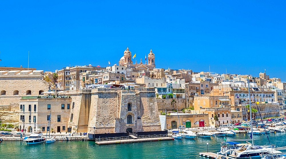 The Basilica of the Nativity of Mary rising over Senglea, and the Vittoriosa Yacht Marina, Valletta, Malta, Mediterranean, Europe