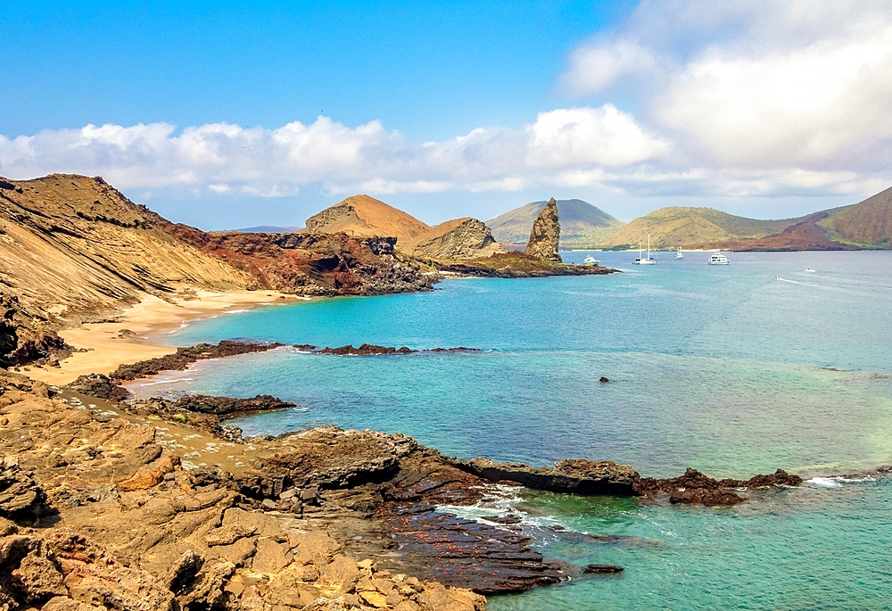 Bartolome Island with Pinnacle Rock, a volcanic plug, to the right, Galapagos Islands, UNESCO World Heritage Site, Ecuador, South America