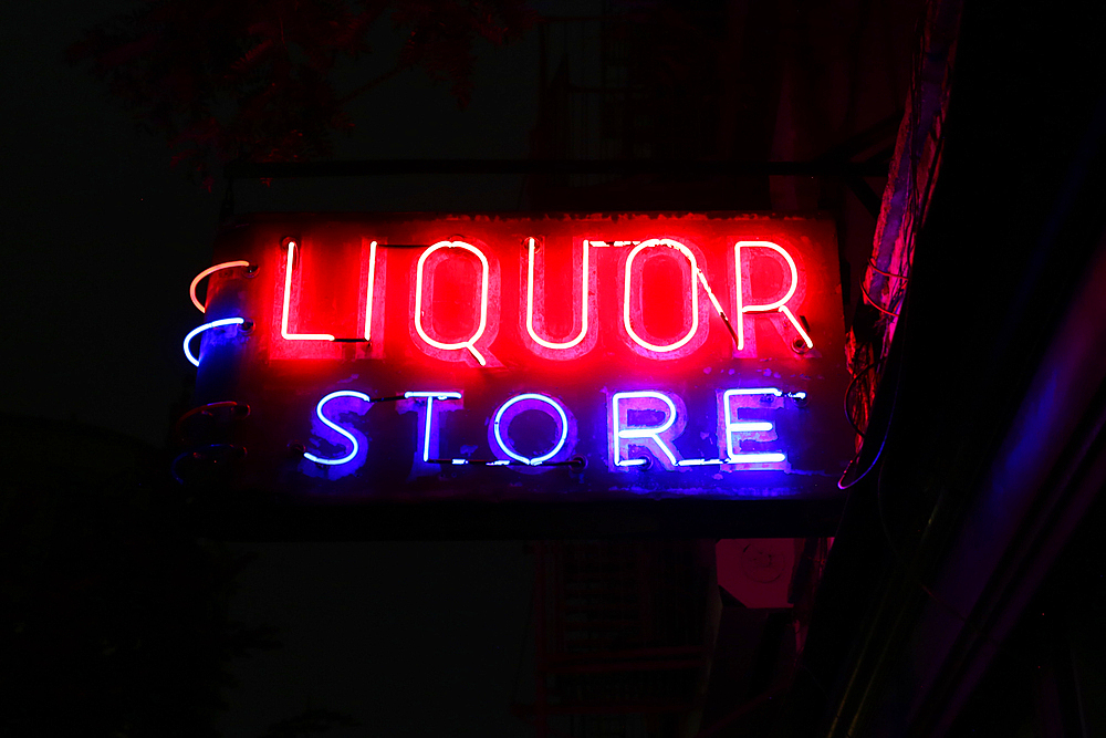 Old Neon Liquor Store advertising sign in Tribeca, Manhattan, New York City, USA.