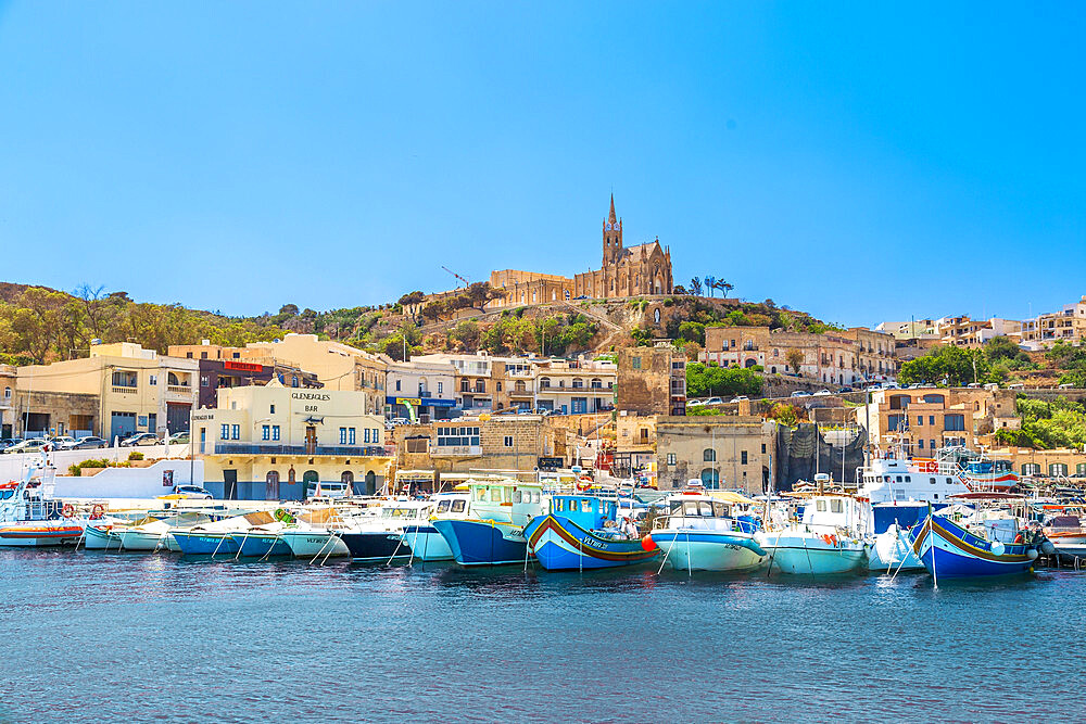 Mgarr Harbour, with the Church of The Madonna of Lourdes behind, Ghajnsielem, Gozo, Malta, Mediterranean, Europe