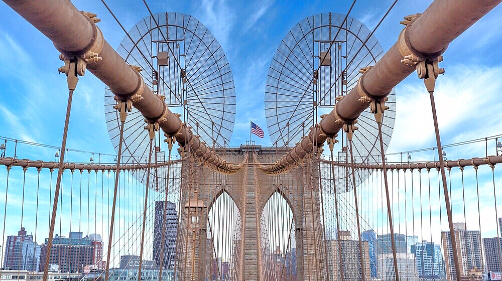 Brooklyn Bridge, New York City, spanning the East River between Manhattan and Brooklyn. When built in 1883 it was the longest suspension bridge in the world.
