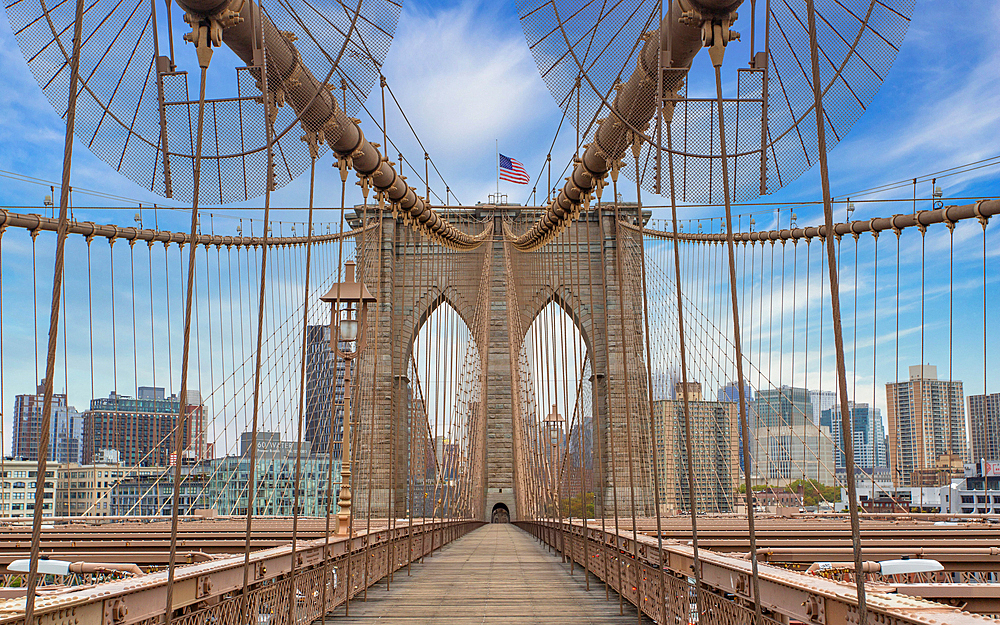 Brooklyn Bridge, New York City, spanning the East River between Manhattan and Brooklyn. When built in 1883 it was the longest suspension bridge in the world and carried railway lines until 1950.