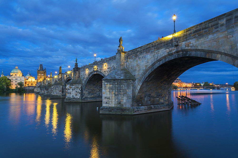 Low angle view of arches of Charles Bridge at twilight, UNESCO World Heritage Site, Prague, Bohemia, Czech Republic (Czechia), Europe