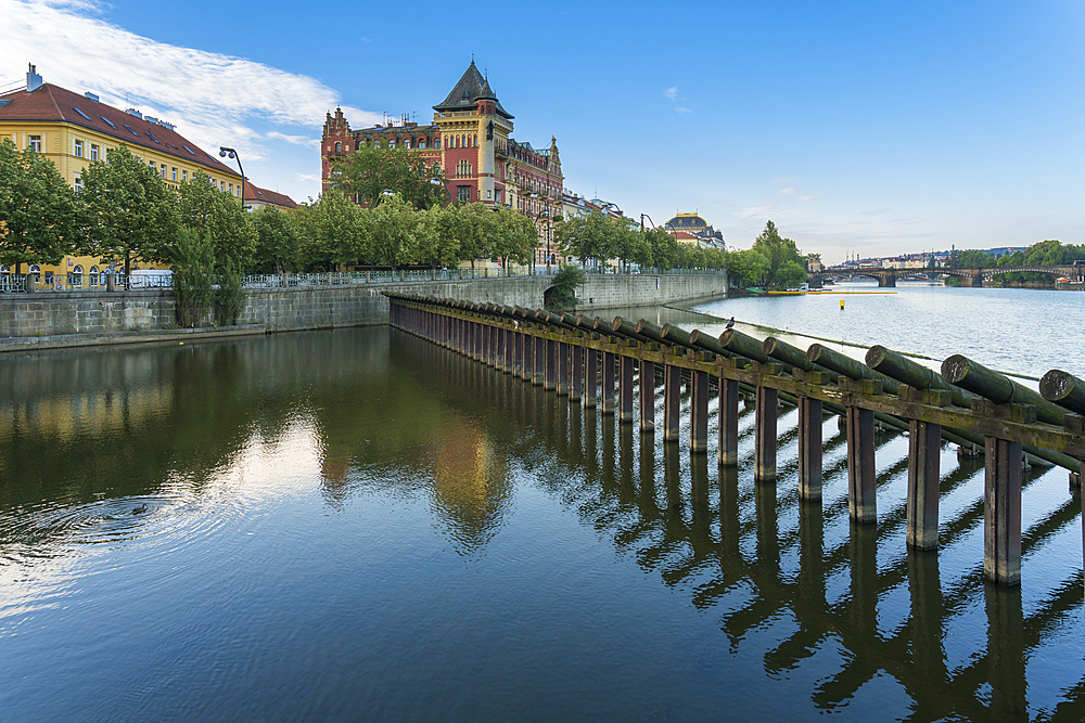 Historic Bellevue building and wooden icebreaker on Vltava River, Prague, Bohemia, Czech Republic (Czechia), Europe