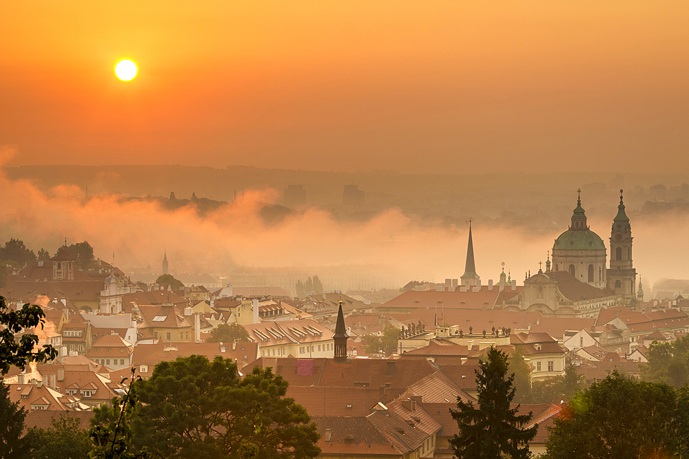 St. Nicholas Church on foggy morning at sunrise, Prague, Czech Republic (Czechia), Europe