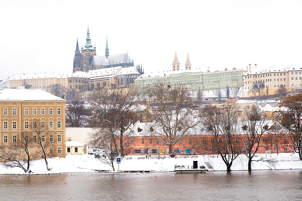 Prague Castle by Vltava river with snow in winter, Prague, Czech Republic