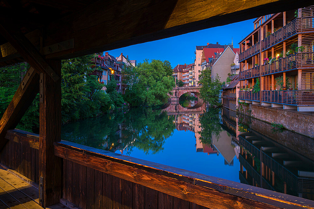 Residential buildings along Pegnitz River seen from wooden Henkersteg bridge, Nuremberg, Bavaria, Germany, Europe