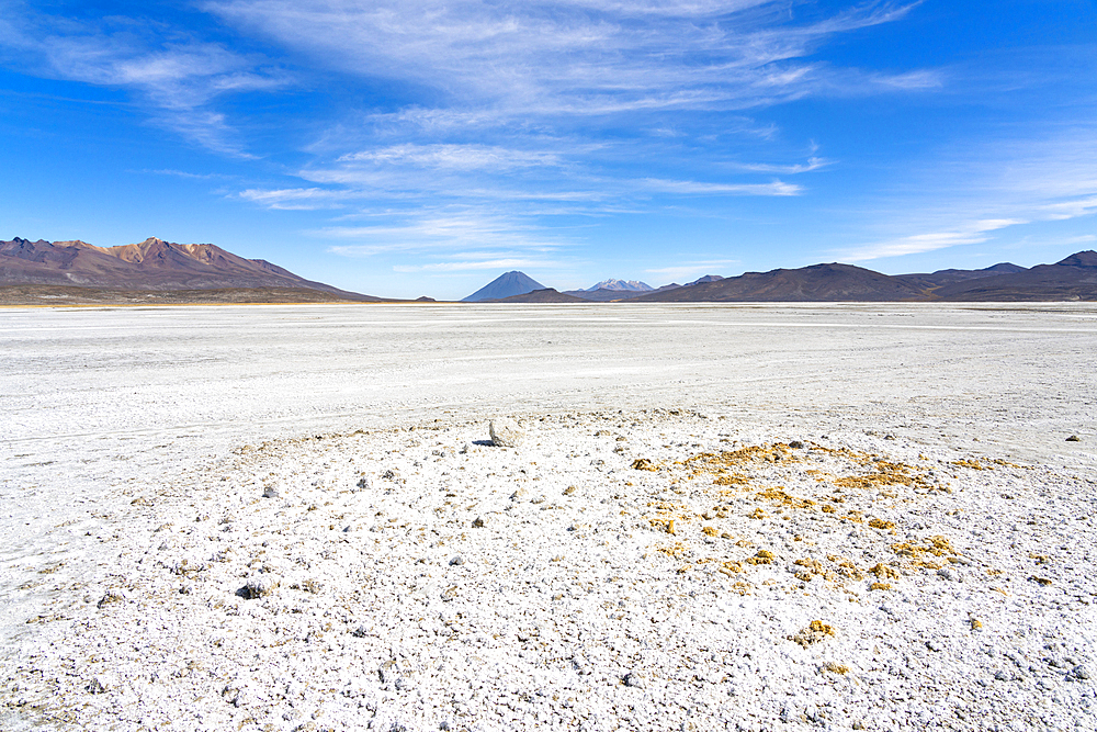 Salt flats and distant views of Pichu Pichu, El Misti and Chachani volcanoes, Salinas y Aguada Blanca National Reserve, Arequipa Province, Arequipa Region, Peru, South America