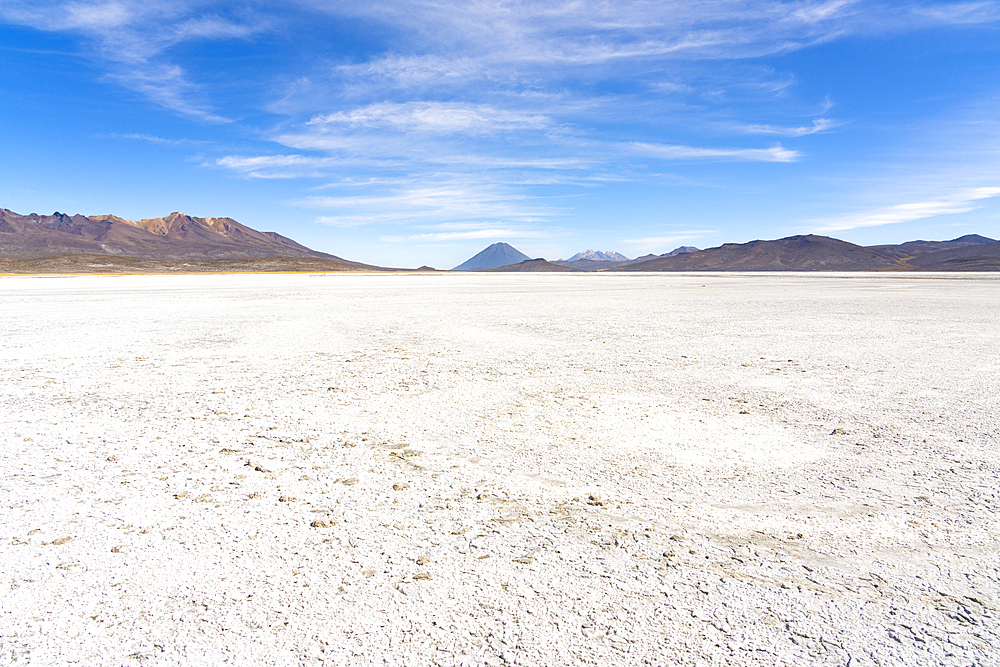 Salt flats and distant views of Pichu Pichu, El Misti and Chachani volcanoes, Salinas y Aguada Blanca National Reserve, Arequipa Province, Arequipa Region, Peru, South America