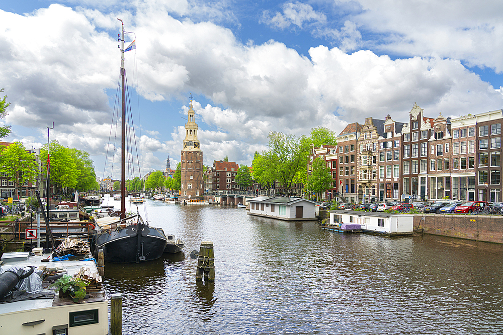 Oudeschans canal and Montelbaanstoren tower in the background, Amsterdam, The Netherlands, Europe