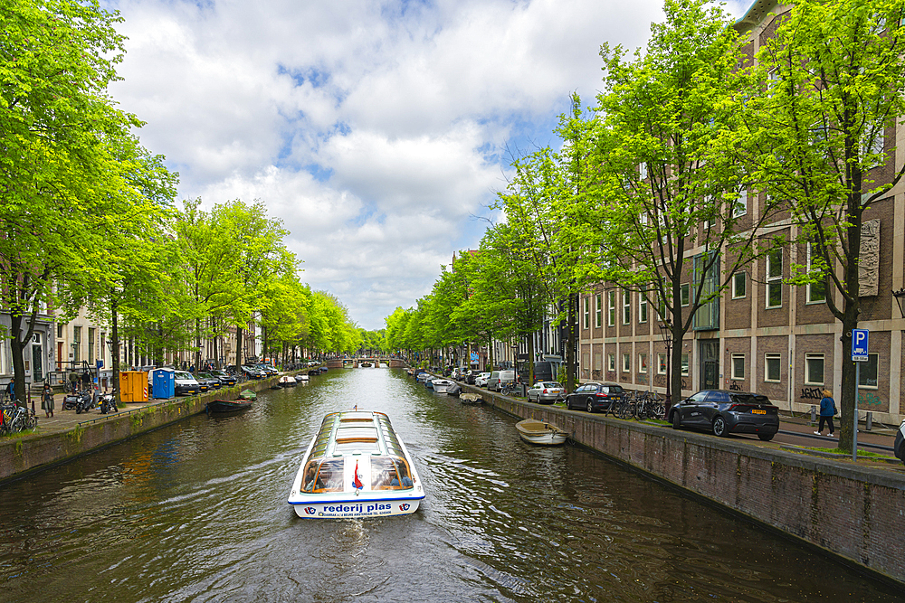 Tourist boat on Herengracht canal, Amsterdam, The Netherlands