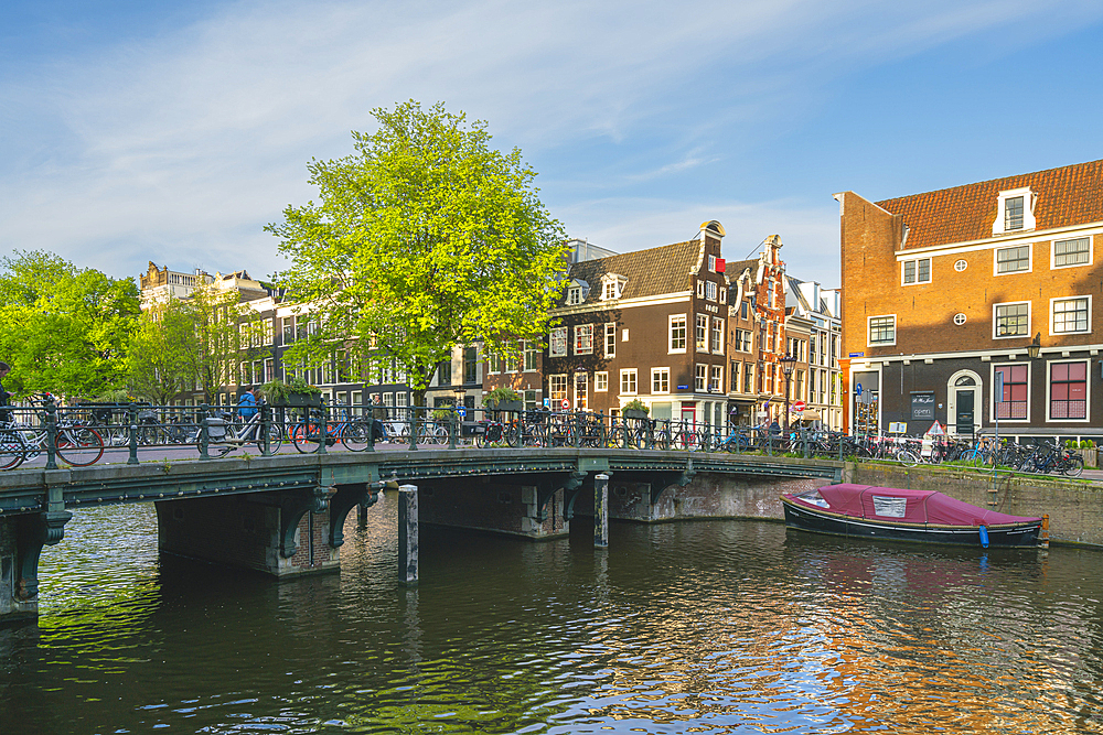 Bridge over Keizersgracht canal at sunset, Amsterdam, The Netherlands, Europe